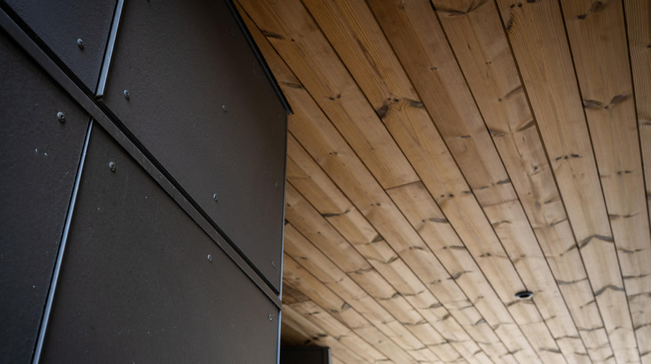 Architectural detail showing the contrasting wood and metal design of the Meadows Neighborhood buildings