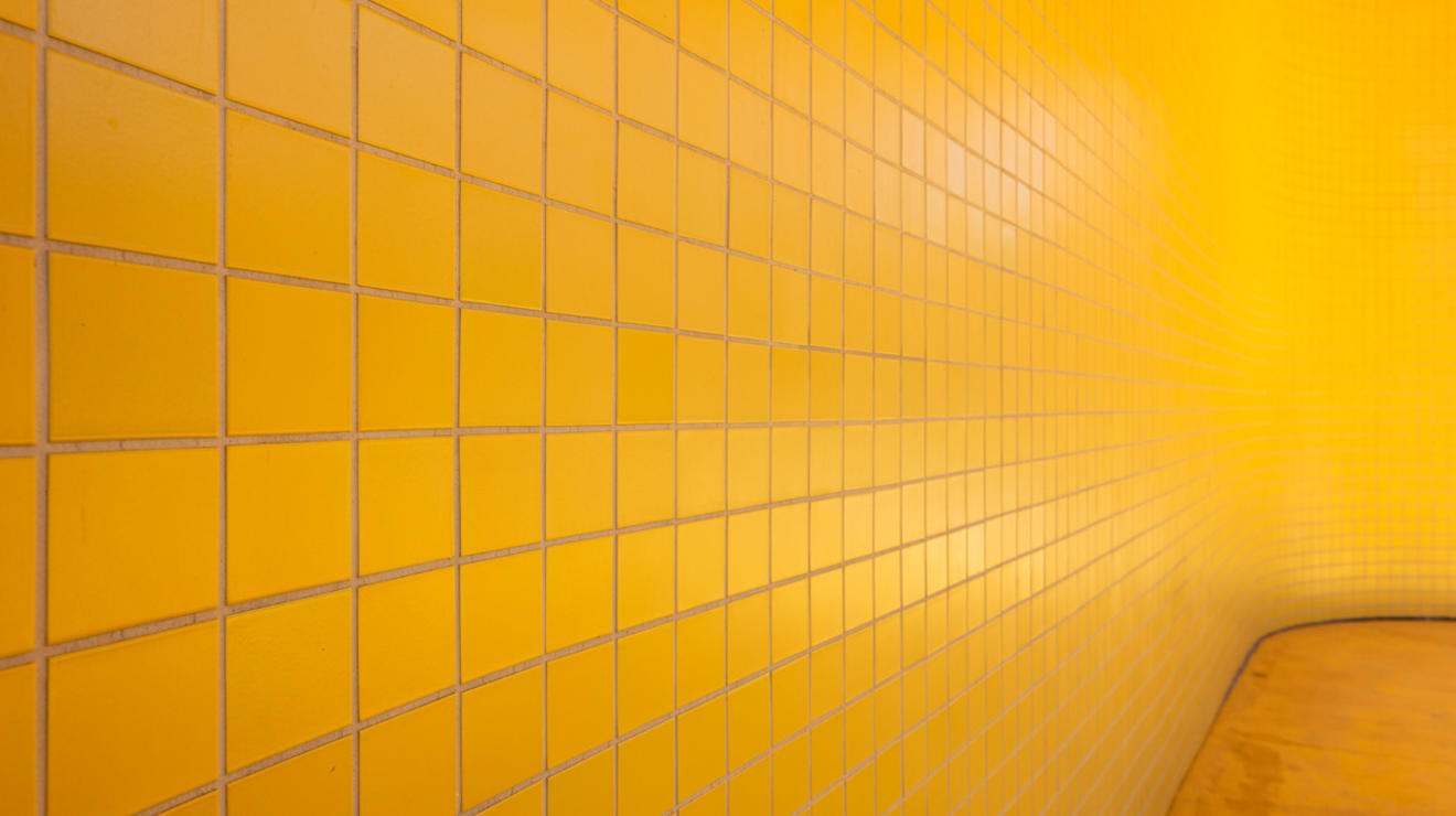 The bold use of bright yellow tiles in the design of Yeh and New College West