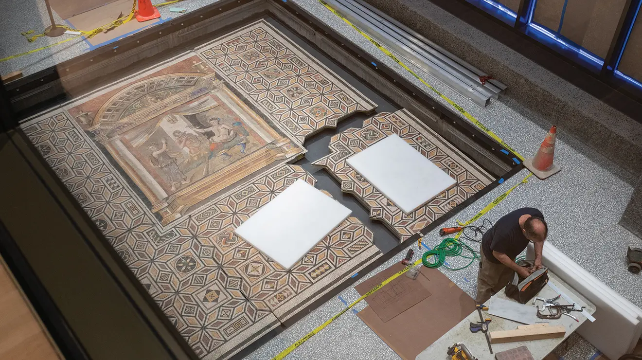 Only one piece of a Roman floor mosaic isn't connected, a quarter of the whole thing that's still detached in the lower right-hand corner.