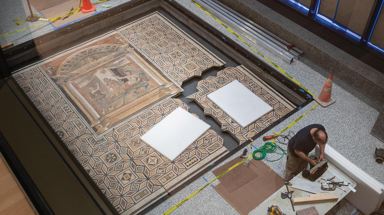 Only one piece of a Roman floor mosaic isn't connected, a quarter of the whole thing that's still detached in the lower right-hand corner.