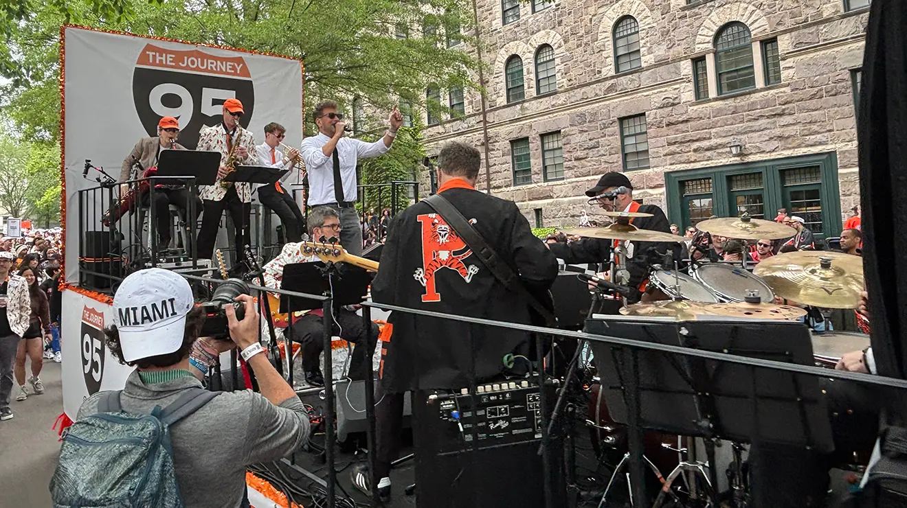 A band with an I-95 sign on the back plays on a rolling float during the 2025 P-rade.