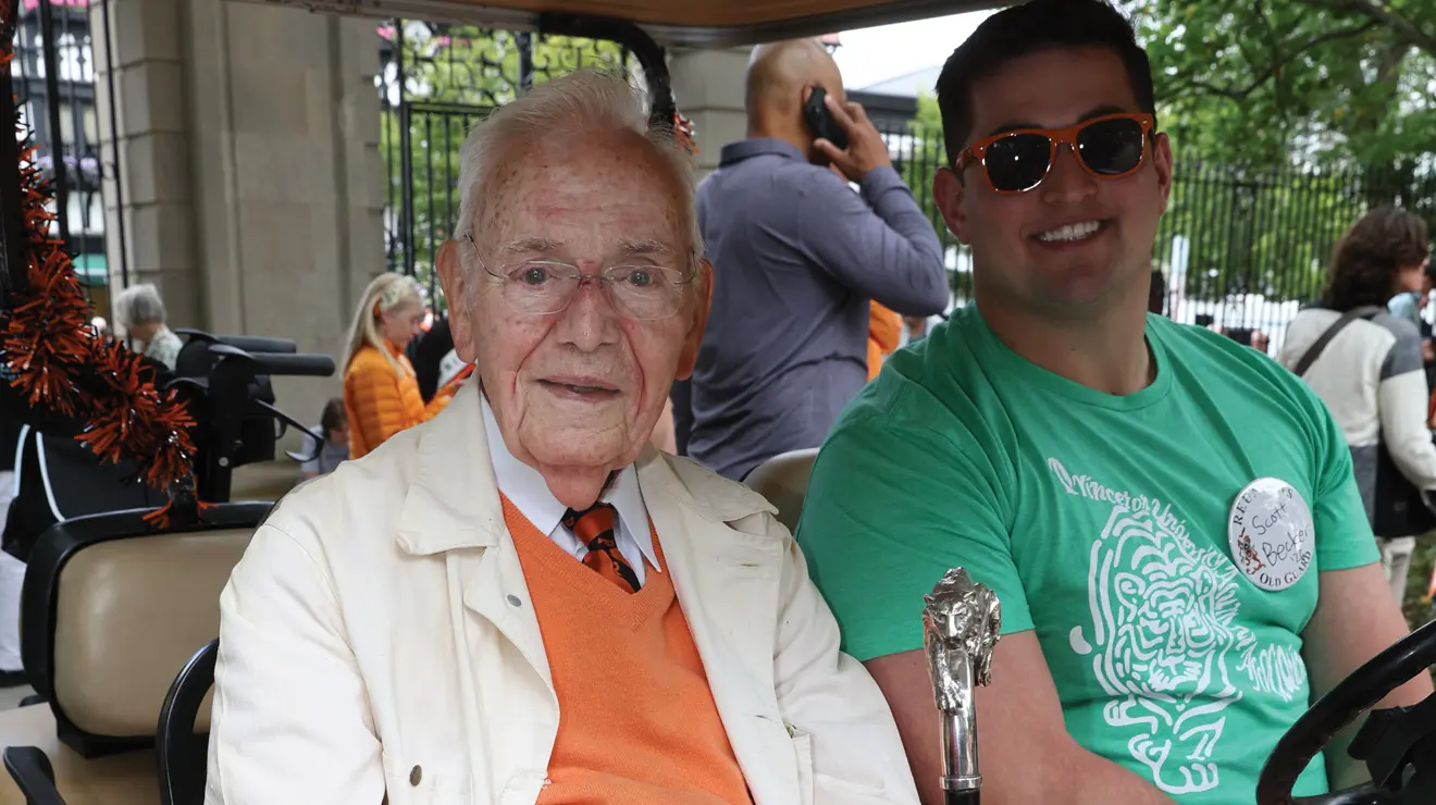 James Amick ’49 *52, holding the Class of 1923 Cane, prepares for the P-rade, most of which he walked.