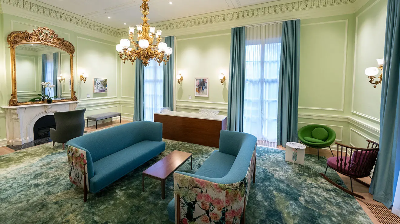 Room with two small couches facing a coffee table