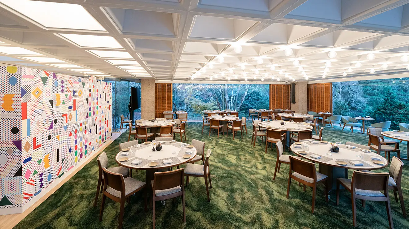 Dining room with waffle-style ceiling and green carpet