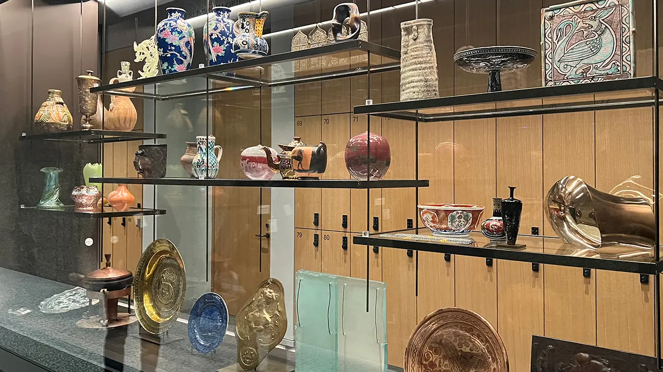 Artwalk_case.jpg A glass case full of art and artifacts.