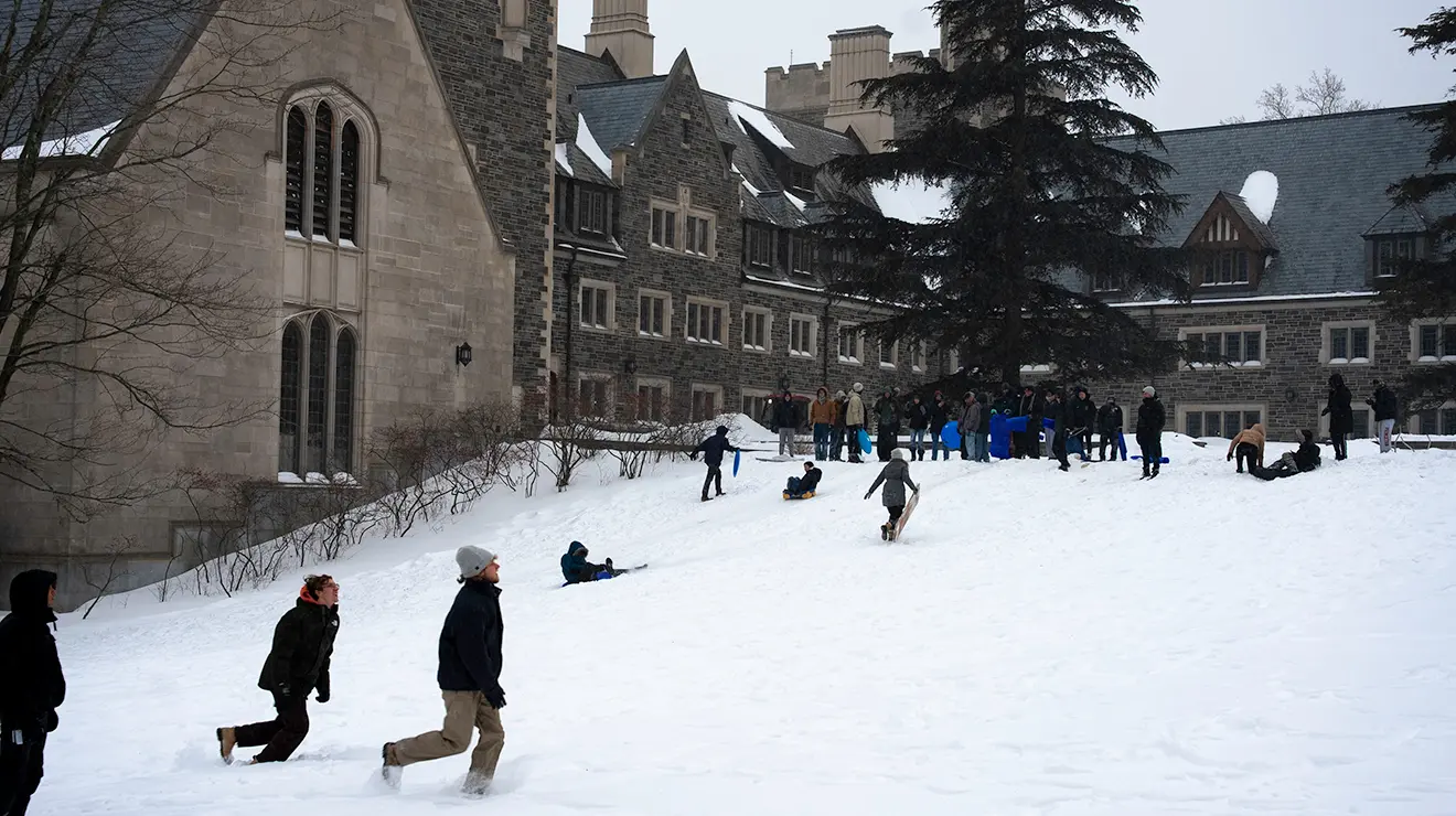 Students play in the snow.