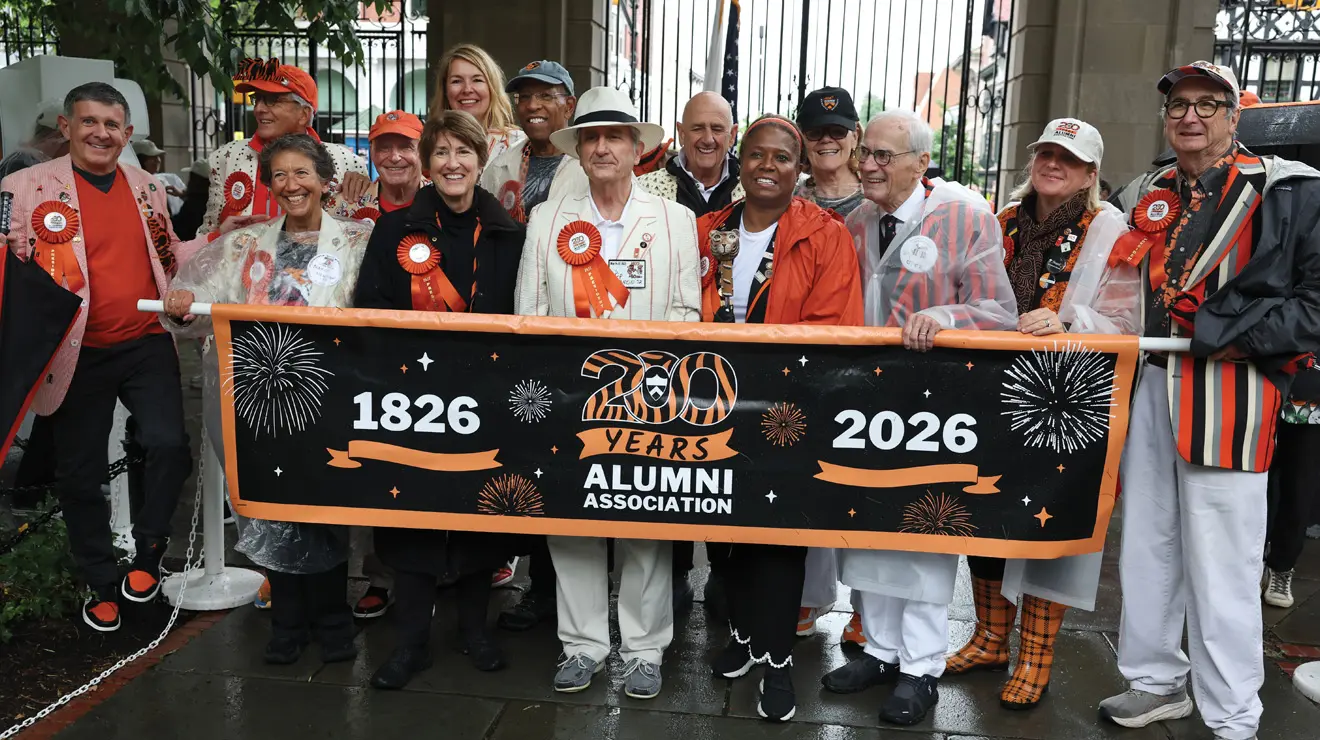 REUNIONS_200 Banner.jpg Alumni Association president Ryan Ruskin ’90, far left, and 13 past presidents mark the association’s 200th anniversary at the start of the P-rade.