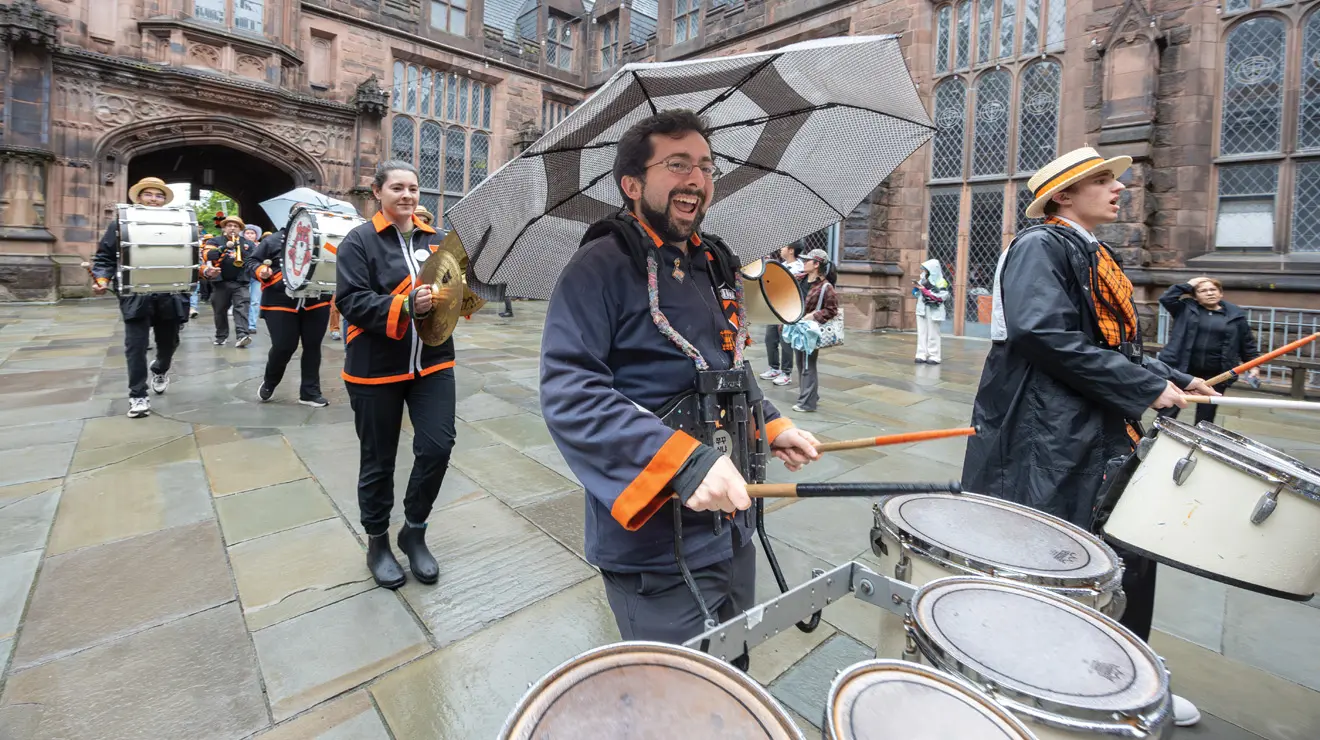REUNIONS_Drummer.jpg Mike Torre ’17 knows how to keep rhythm and stay dry.