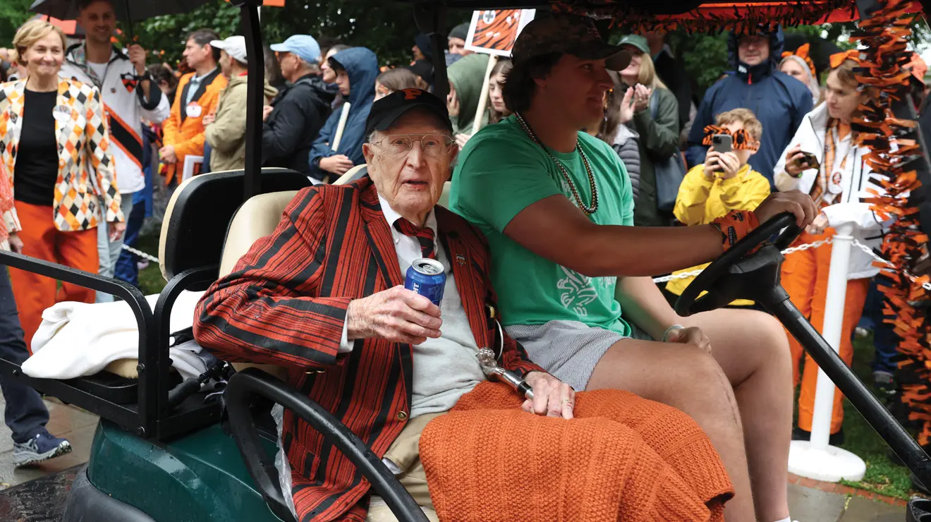 REUNIONS_Silver Cane.jpg ick Judge ’46 with the silver cane, a cold beer, and a warm blanket.