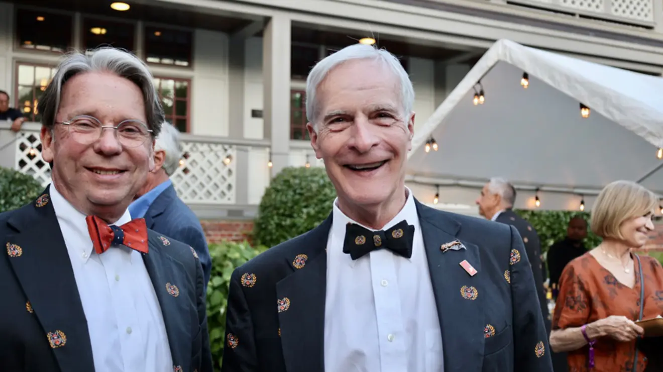 Two men in bow ties. 