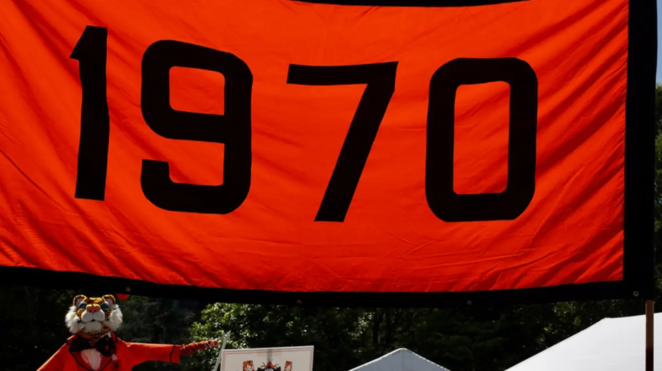 An orange-and-black banner that reads "1970."