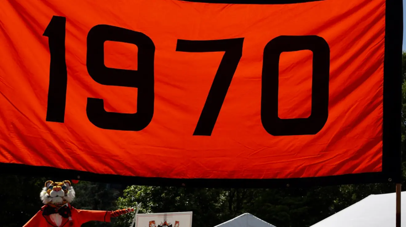 An orange-and-black banner that reads "1970."
