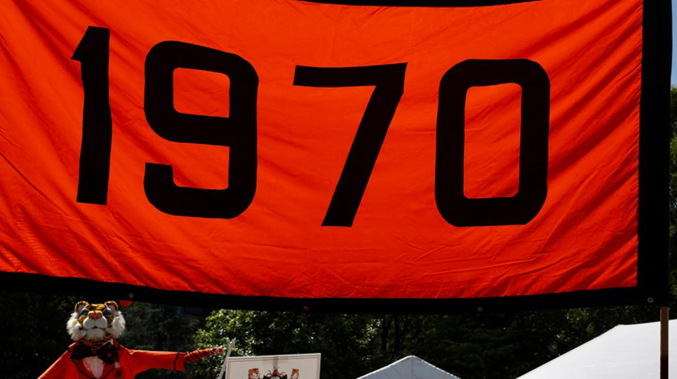An orange-and-black banner that reads "1970."