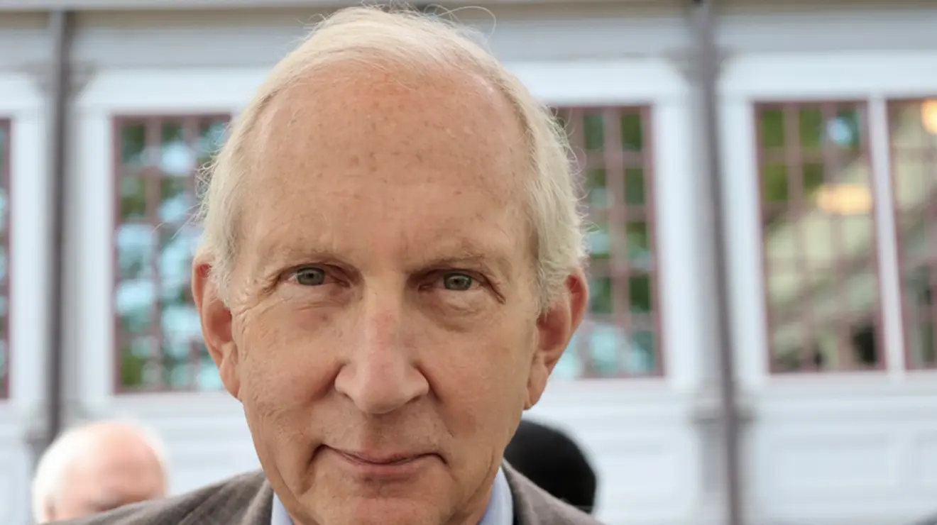 A man looks at the camera.