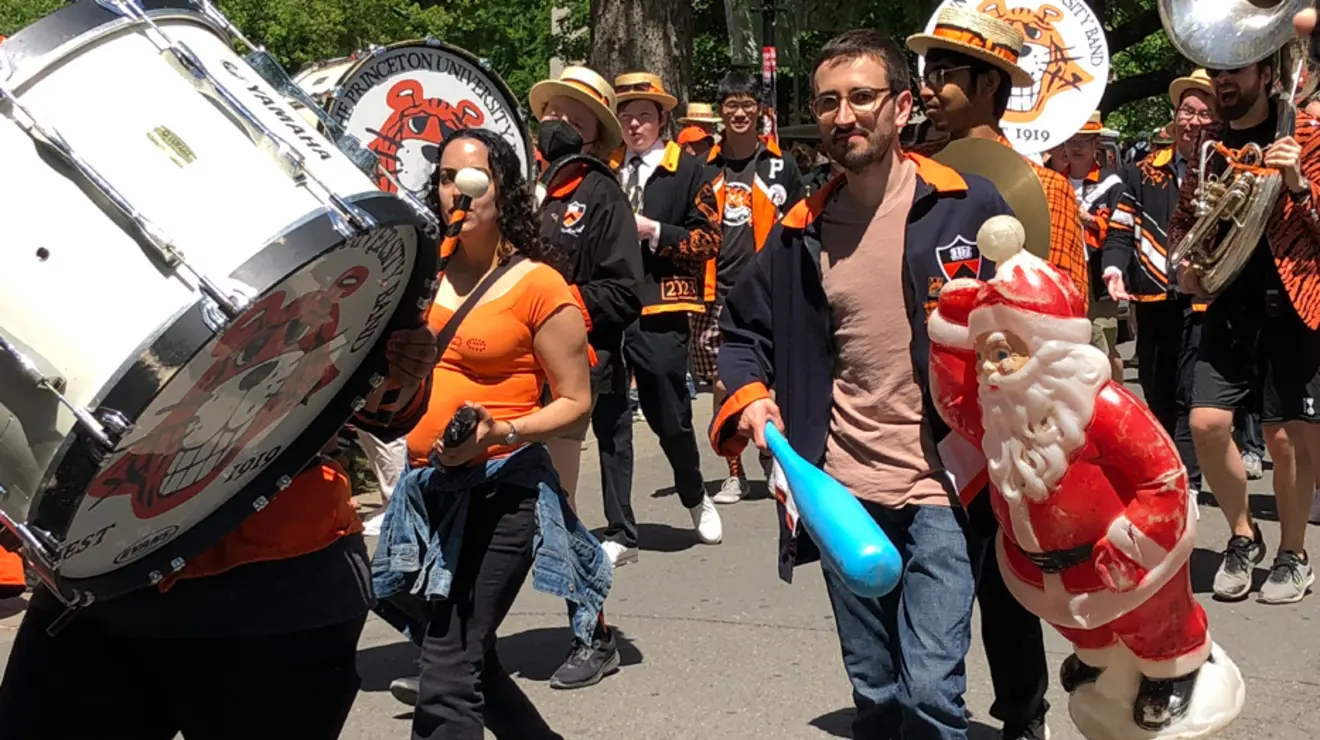BT-prade-3.jpg Band members march in the P-rade; one holds a baseball bat and a plastic Santa Clause.