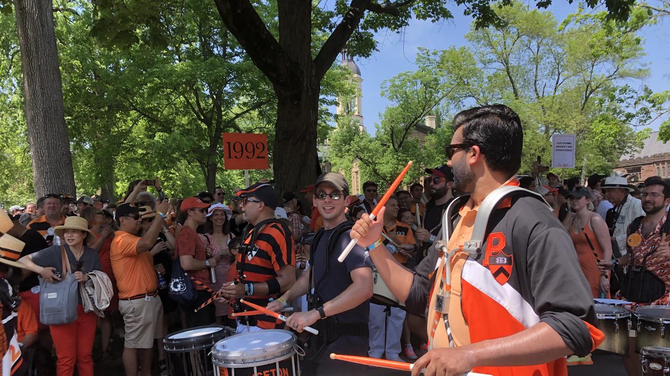 Alumni play drums just before the P-rade starts.