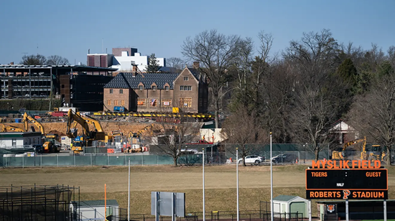 A view across Roberts Stadium of the ES & SEAS construction with the former Court Club up on wheels.