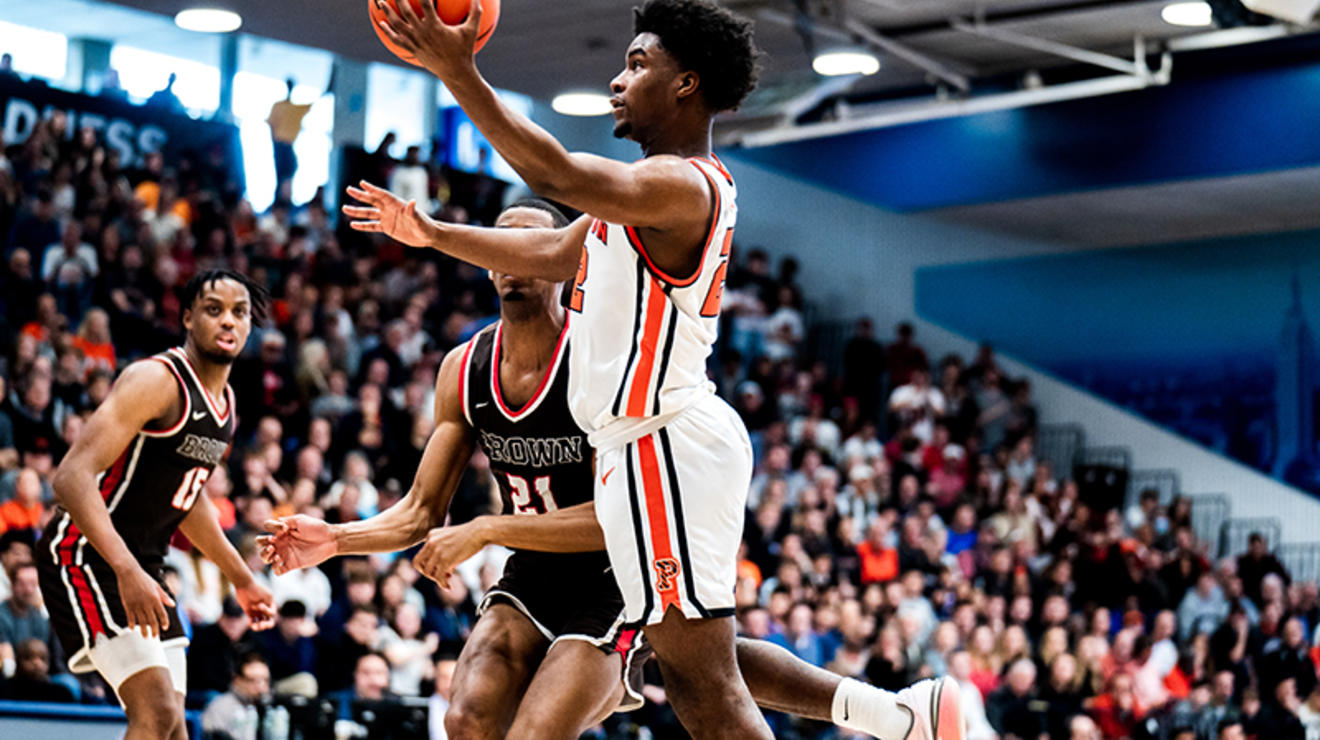 Dalen Davis ’27 scoops in a layup for two of his 21 points against Brown.