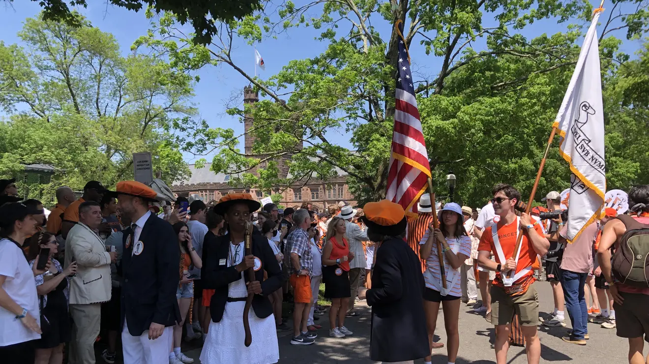 Flags_mm.jpg Alumni hold flags waiting for the P-rade to begin.