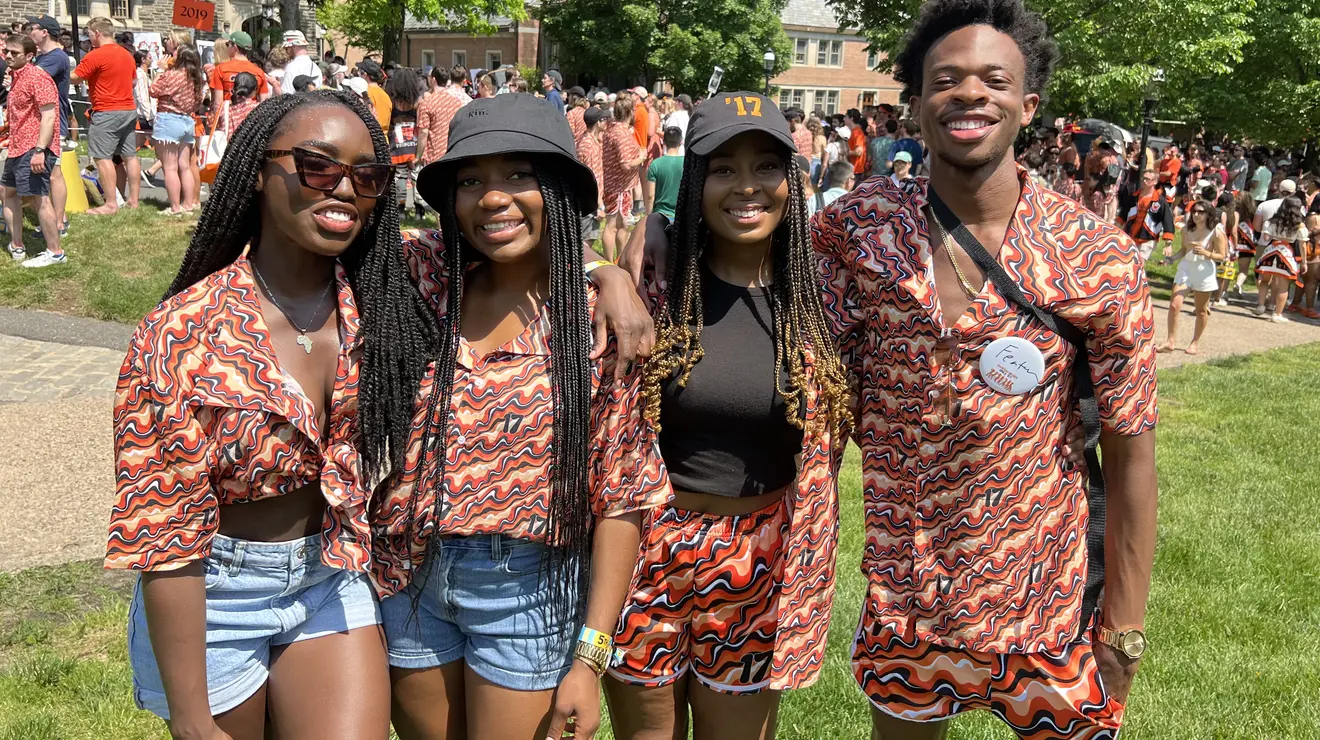 Four2017_liz.jpg Four 2017 alumni smile for the camera in their matching class shirts.