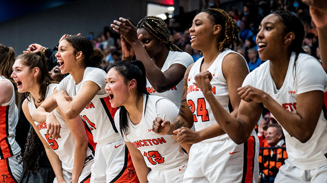 Princeton’s bench cheers for the Tigers during the second half of the women’s semifinal win over Penn.