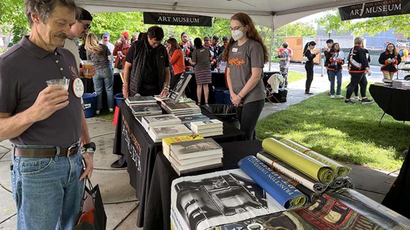 Shoppers peruse books at the Princeton Art Museum tent.