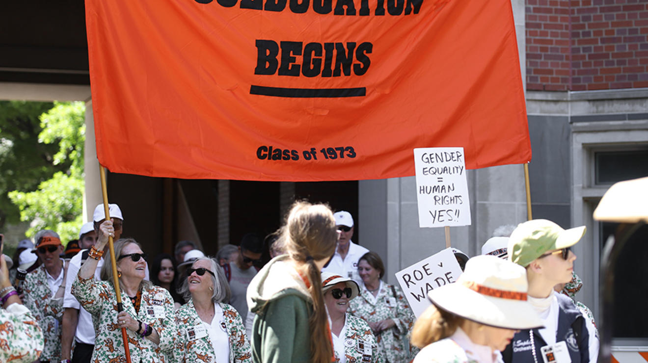 The orange "Coeducation Begins: Class of 1973" banner in the P-rade.