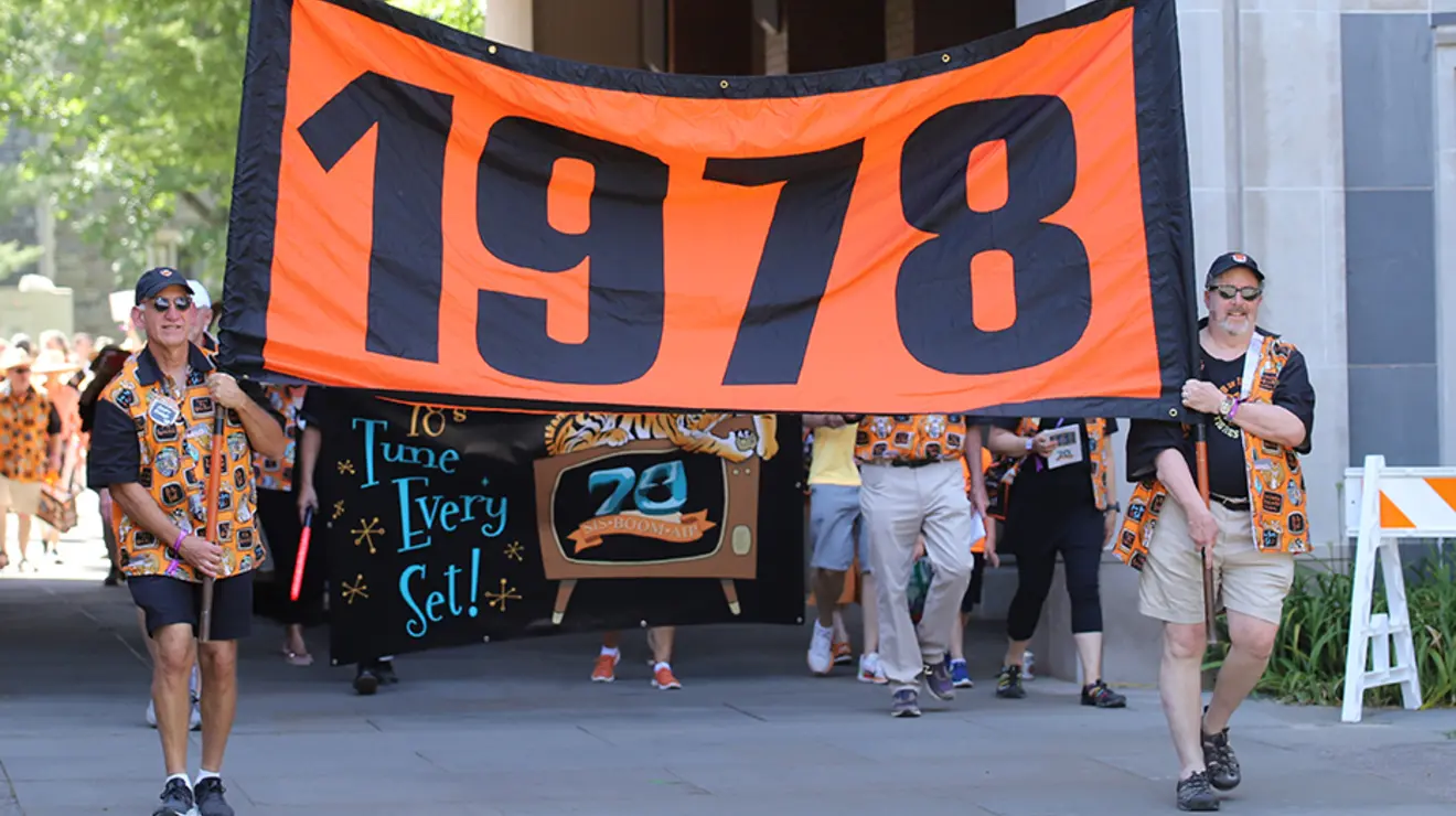 PRADE23_Allison-30.jpg Two guys carry the "1978" banner.