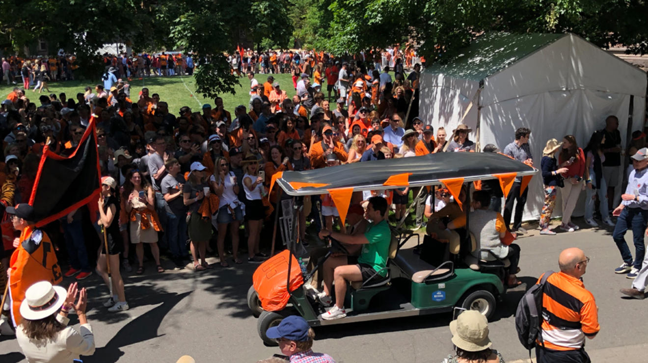 Someone drives a golf cart in the P-rade.