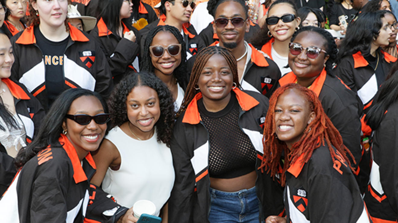 Friends smile and pose for a photo at the P-rade.