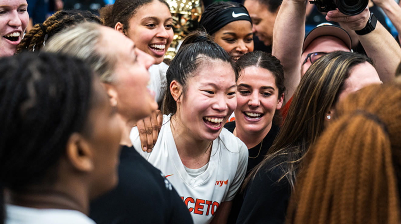 Kaitlyn Chen ’24 celebrates with her coaches and teammates.