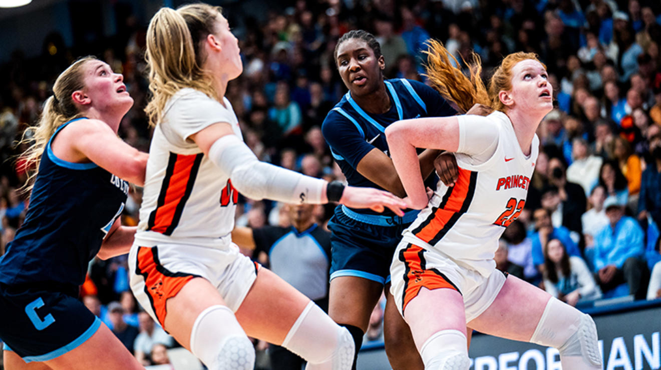 Parker Hill ’25, right, and Ellie Mitchell ’24 box out for a rebound against Columbia.