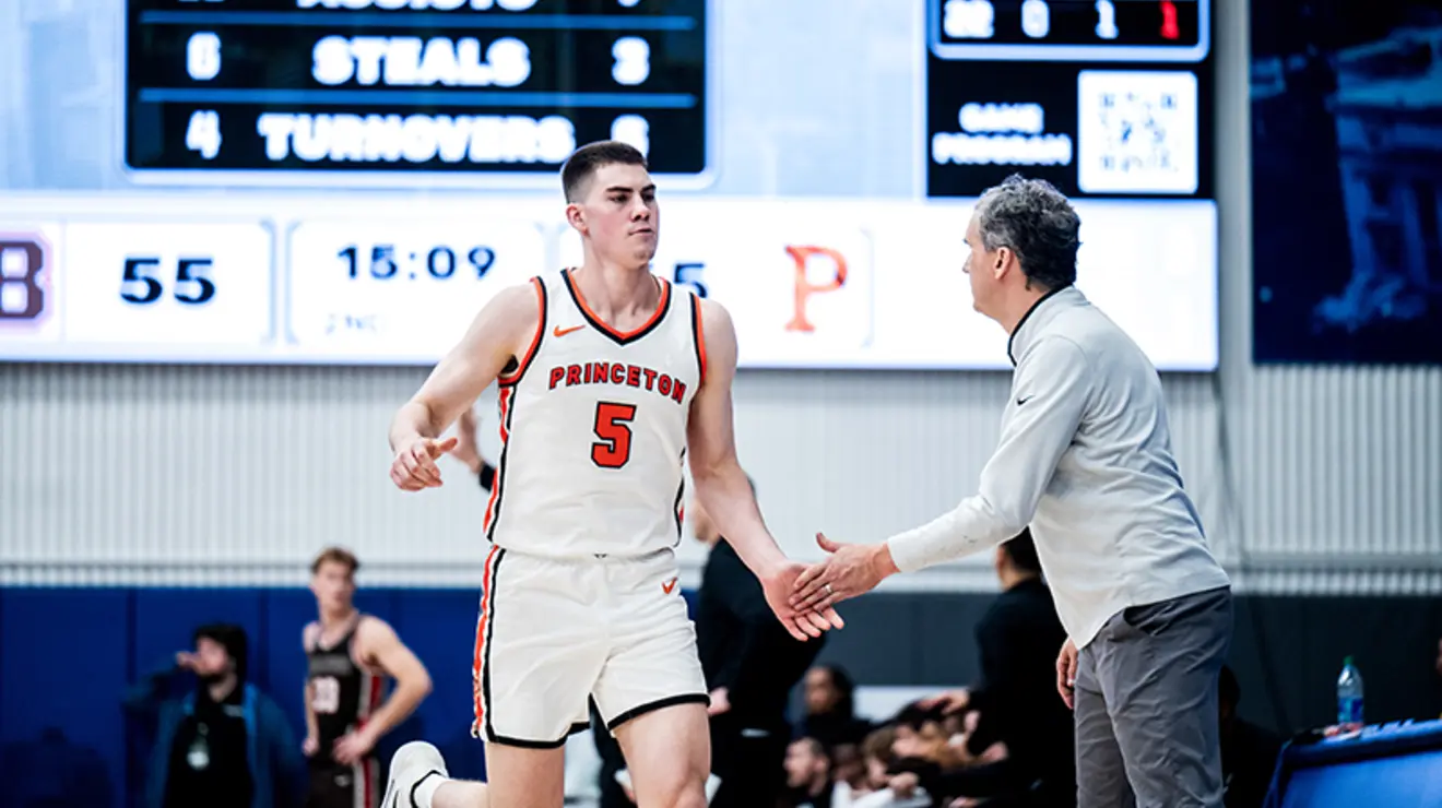 scott-sideline.jpg Coach Mitch Henderson ’98 greets Jack Scott ’26 on the sideline.