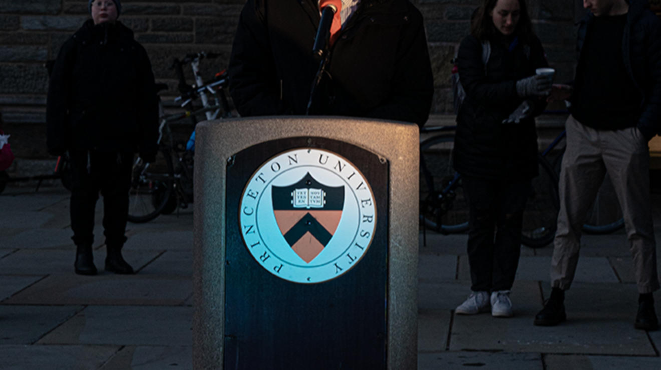 President Christopher Eisgruber speaks at a podium with Princeton's seal on it.