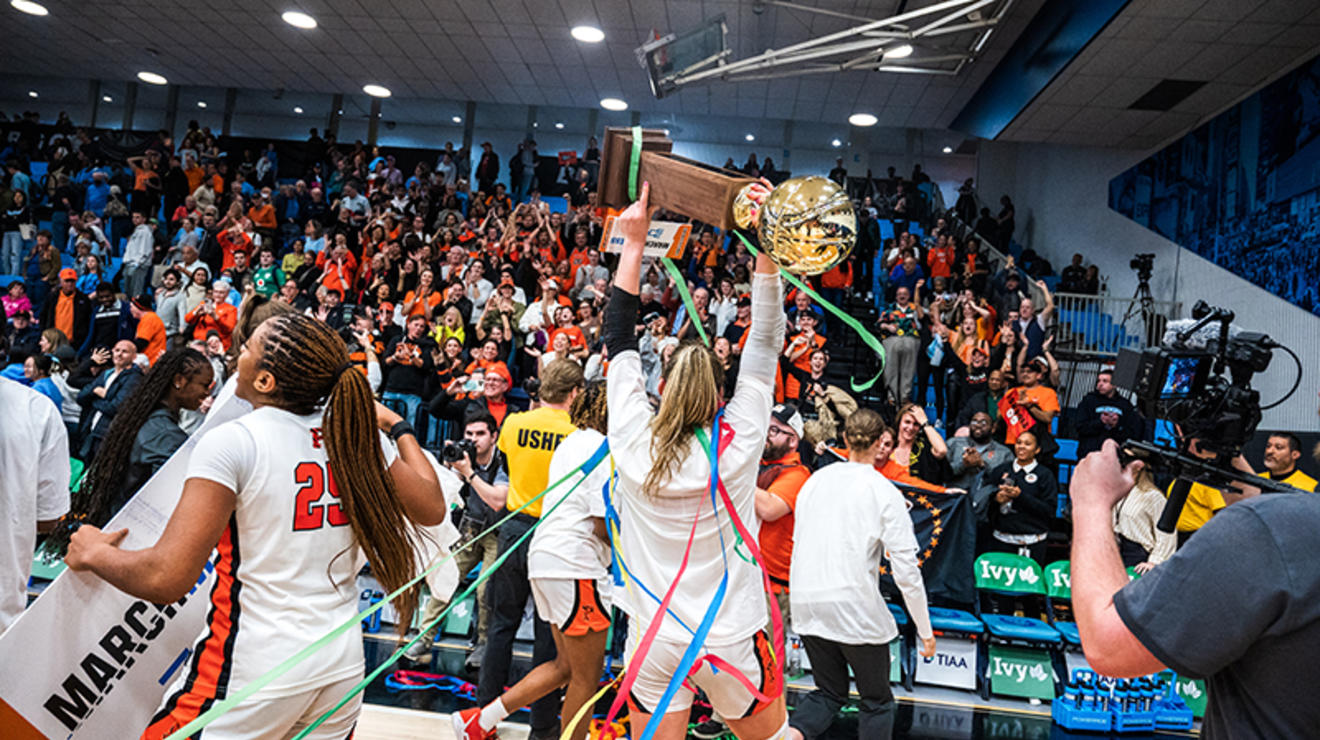 Ellie Mitchell ’24 lifts the Ivy Tournament trophy for the Princeton crowd.