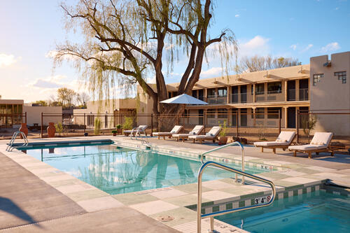 Hotel-Willa_Taos_Tiger-Travels.jpg Glamor shot of the stunning pool of Hotel Willa in Taos, New Mexico, surrounded by lounge chairs.