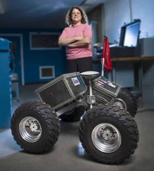 Laura Ray &rsquo;84 *91 with Yeti, the robot she and her students built.