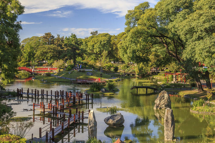 View of the Japanese Garden where water, trees, and small bridges are visible.