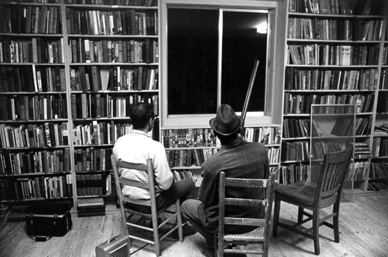 0994624.jpg Community Center Construction, Freedom Summer 1964: Summer volunteer carpenter Jim Boebel and a local resident post a shotgun watch at the community center against a fire-bomb threat by local whites. Threats were common that summer and local men took tur