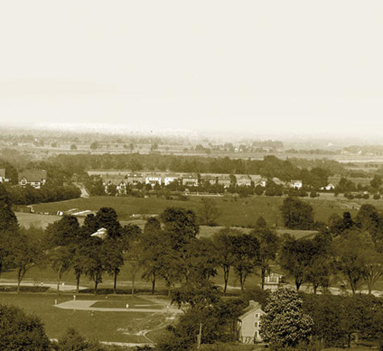 Recently erected for Woodrow Wilson’s preceptors, these houses of Broadmead appear beyond the field where Palmer Stadium would be built the following year. A century ago, Princeton’s setting was pleasantly rural.