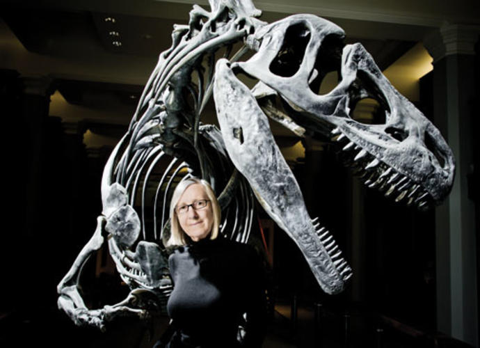 Gerta Keller in the atrium of Guyot Hall, with an Antrodemus dinosaur excavated during a 1941 dig.