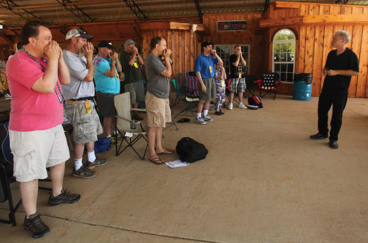 Gussow leads a class of harmonica enthusiasts at the Hill Country festival.