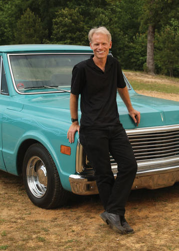 Gussow with his “automotive toy,” a 1972 Chevy Cheyenne that he bought in 2009 and souped up. It’s “quite a rumble when you fire her up,” he says. “Living in Manhattan for 22 years, I could never indulge my passion.”