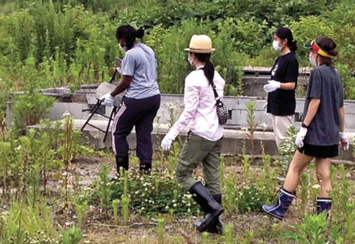 Princeton students search for personal effects among the foundations of homes swept away by the tsunami near Otsuchi Bay in Kamaishi.