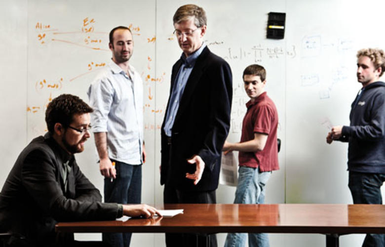  Schultze and Felten ­discuss a problem with graduate students, from left, William Clarkson, Joseph Calandrino, and William Zeller.
