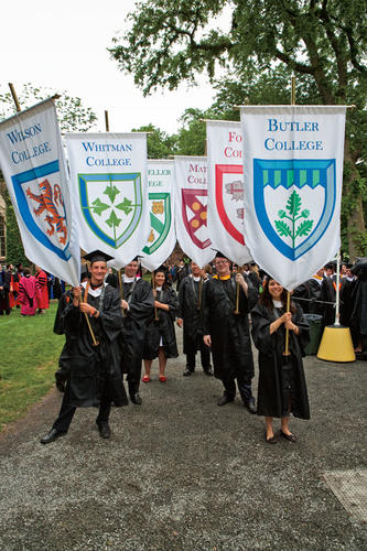 From left, Alex Barnard ’09, Steve Sims ’09, Maria Salciccioli ’09, George Lan ’09, Alex Knezu ’09, and Adrian Diaz ’09 carry the standards of Princeton’s residential colleges.