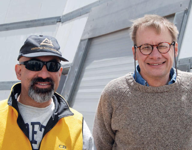 Professors David Spergel ’82, left, and Lyman Page at the ACT site. 