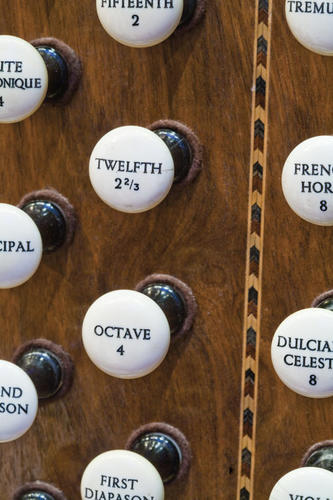 The “stop” knobs determine which ranks play, ultimately controlling the air flowing into the pipes.