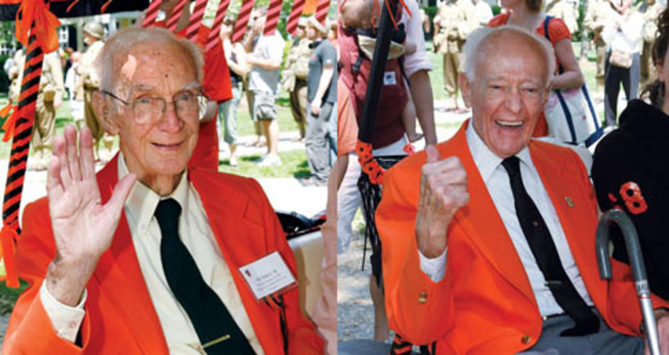 Jack Bales ’34, left, and Bill Selden ’34 acknowledge cheers along the P-rade route.