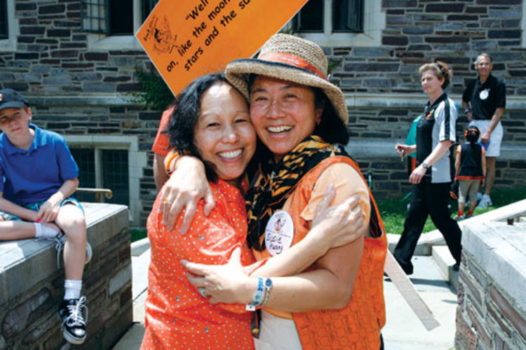 Vicki Takeuchi Wynne ’74, left, and Susie Huang ’76 are excited to find each other at Wynne’s 35th.